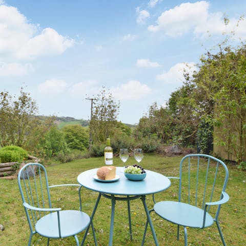 Watch the sunset from your bistro table while you sip on wine and nibble on snacks