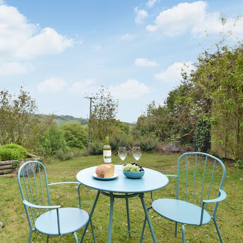 Watch the sunset from your bistro table while you sip on wine and nibble on snacks