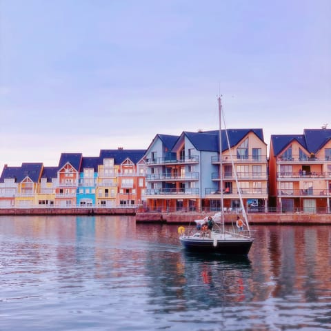 Stroll along the beautiful harbour of Deauville