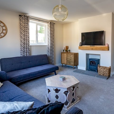 Cosy up for movie night in the comfy living room 