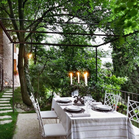 Dine alfresco under the pergola with stunning views