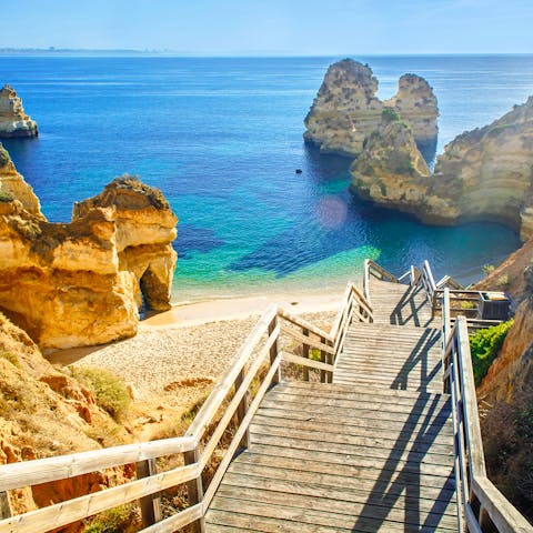 Soak up the sunshine on Praia de Alvor beach, a twenty-five minute walk away