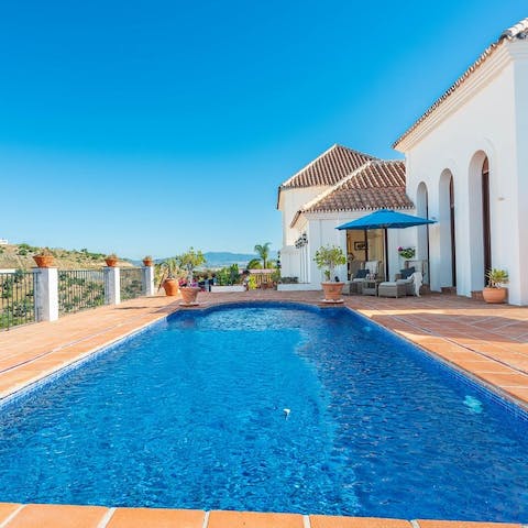 Float about elegantly in the villa's swimming pool surrounded by terracotta tiles
