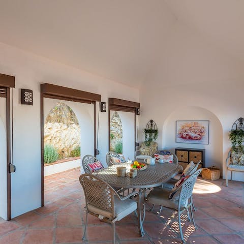 Fire up the barbecue and serve up smoky flavours on the covered terrace