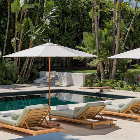 Luxuriate in a haven of peace from the poolside day beds 