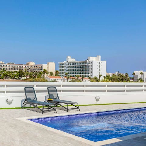 Bask in the Cyprus sunshine on a poolside lounge chair