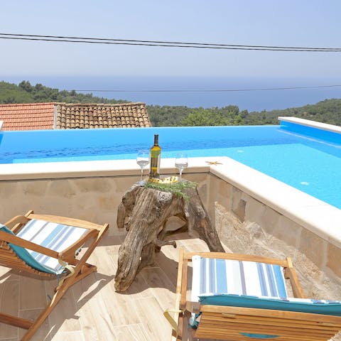 Relax by the pool and marvel at the spectacular island views