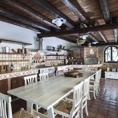 Cook up an outdoor feast in the rustic kitchen with its wood burning stove