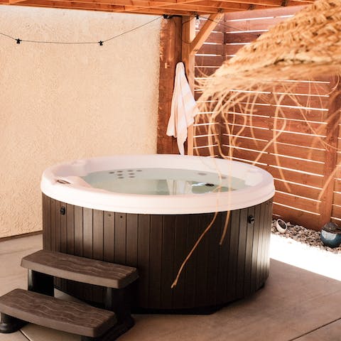 Feel the soothing warmth of the hot tub
