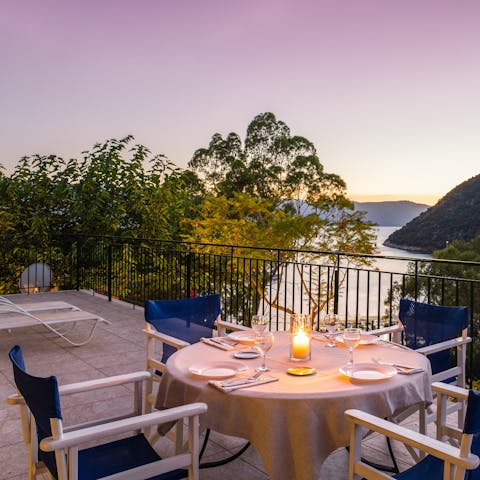 Gather for a sunset dinner overlooking the beautiful bay below