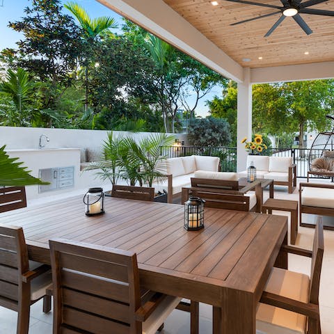 Dine alfresco on a homemade dinner cooked by a private chef under the pergola 