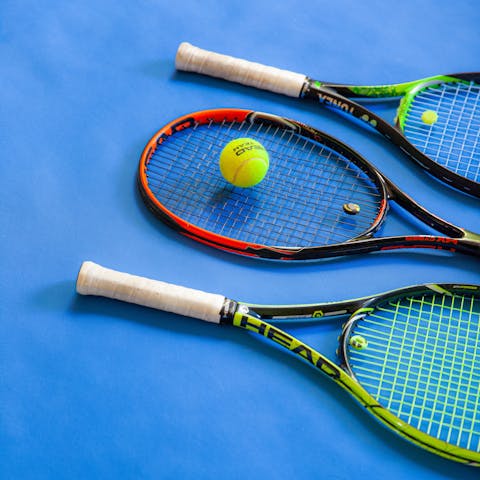 Challenge the family to game on tennis on the resort's shared courts