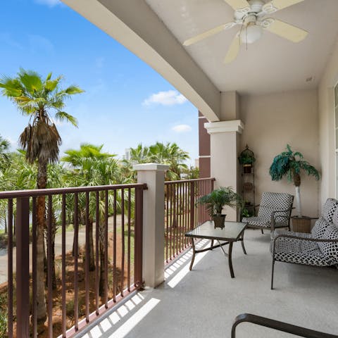 Immerse yourself in views of swaying palm trees while relaxing on the balcony 