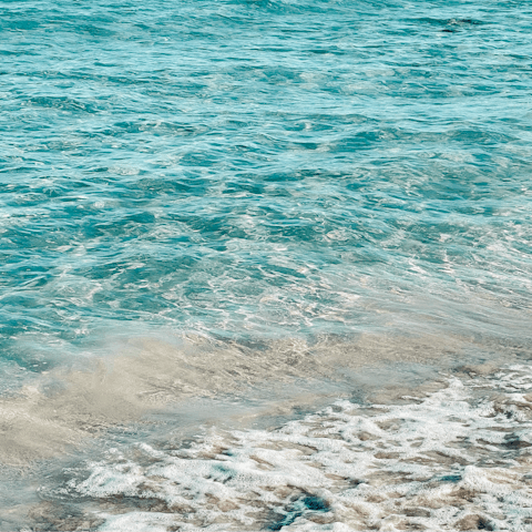 Wander down to Ftelia Bay and swim in the turquoise waters