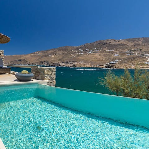 Enjoy views of the Aegean from the edge of your private infinity pool