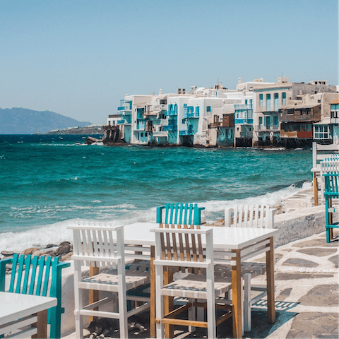 Soak in the bustling atmosphere of the old port in Mykonos