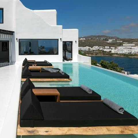 Spend relaxing days lounging by the pool and gazing across the horizon