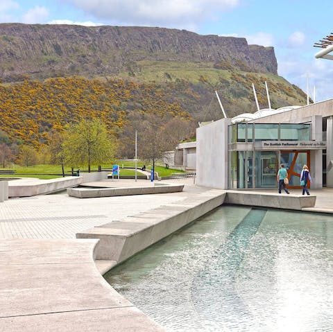 Take a one-minute stroll down the road to the Scottish Parliament and Salisbury Crags