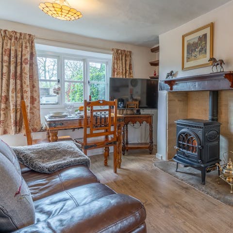 Curl up in front of the wood-burner effect stove after a long walk through the countryside