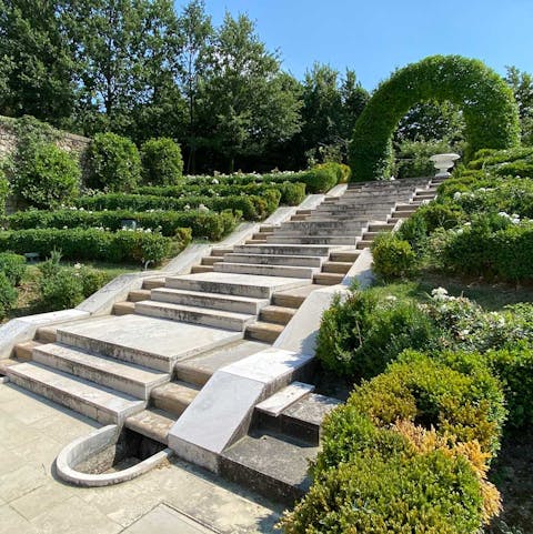 Explore the perfectly manicured gradens filled with water features and blooming roses