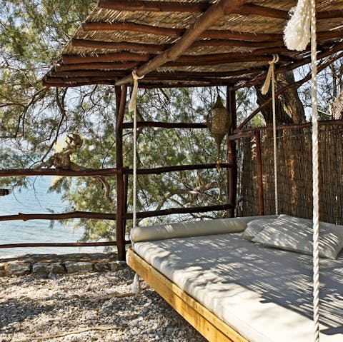 Find the perfect spot to sip evening drinks on the swing bed