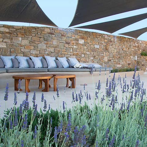 Recline in outdoor lounges to scent of lavender on the sea breeze