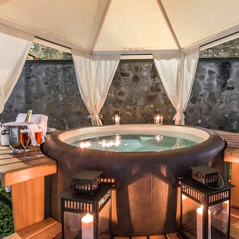 Unwind in the jacuzzi with a glass of local Italian wine in hand