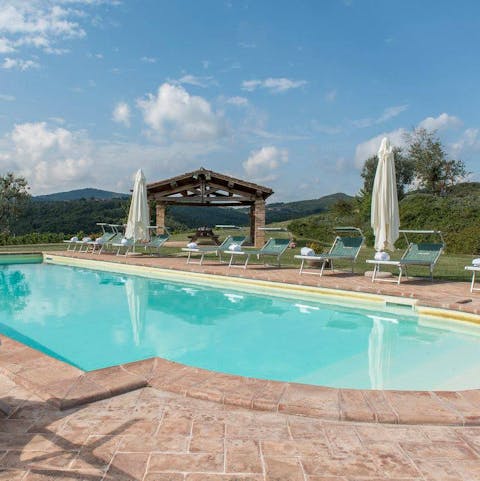 Enjoy the sunshine and stunning views by the large private pool