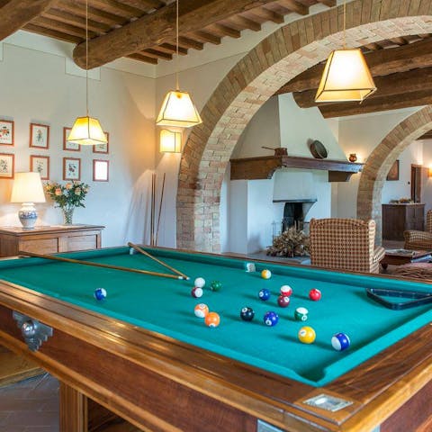 Gather in the evening for a game of billiards with friends