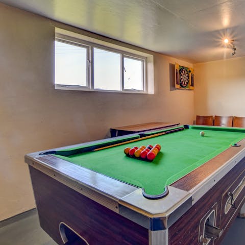 Enjoy a friendly game of pool or darts in the games room