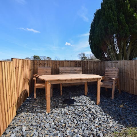 Relax and dine alfresco in the sunny garden with views of Arenig Mountain 