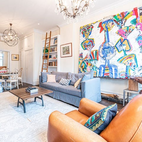 Relax in a cosy apartment decorated with your host's artwork and travel souvenirs