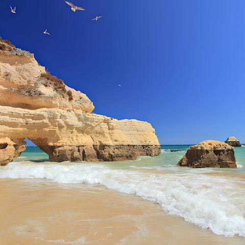 Pack a beach bag and take the short drive to the Algarve's beautiful coast