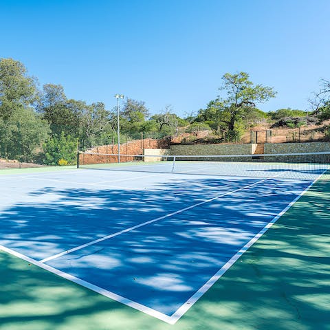 Embrace competitive fun on the private tennis court