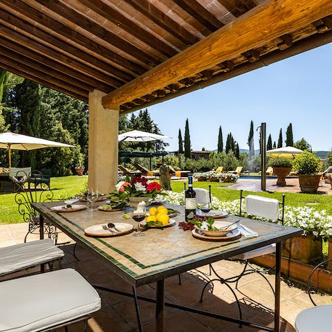 Gather for alfresco breakfasts, lunches, and dinners under the shade of the covered terrace