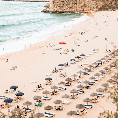 Take a scenic drive down to the golden sandy Praia dos Arrifes