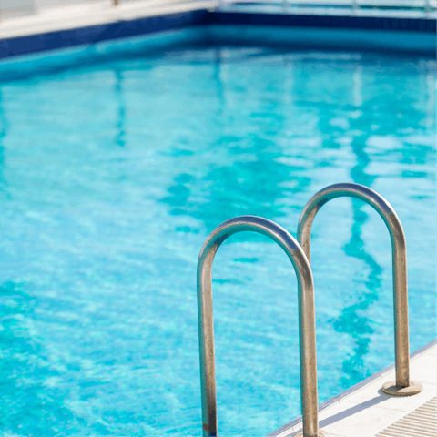 Go for a dip in the communal resort-style pool