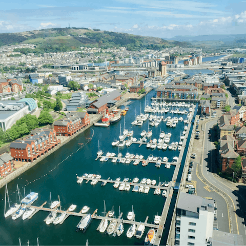 Watch the boats coming in and out of Swansea Marina, right outside your door