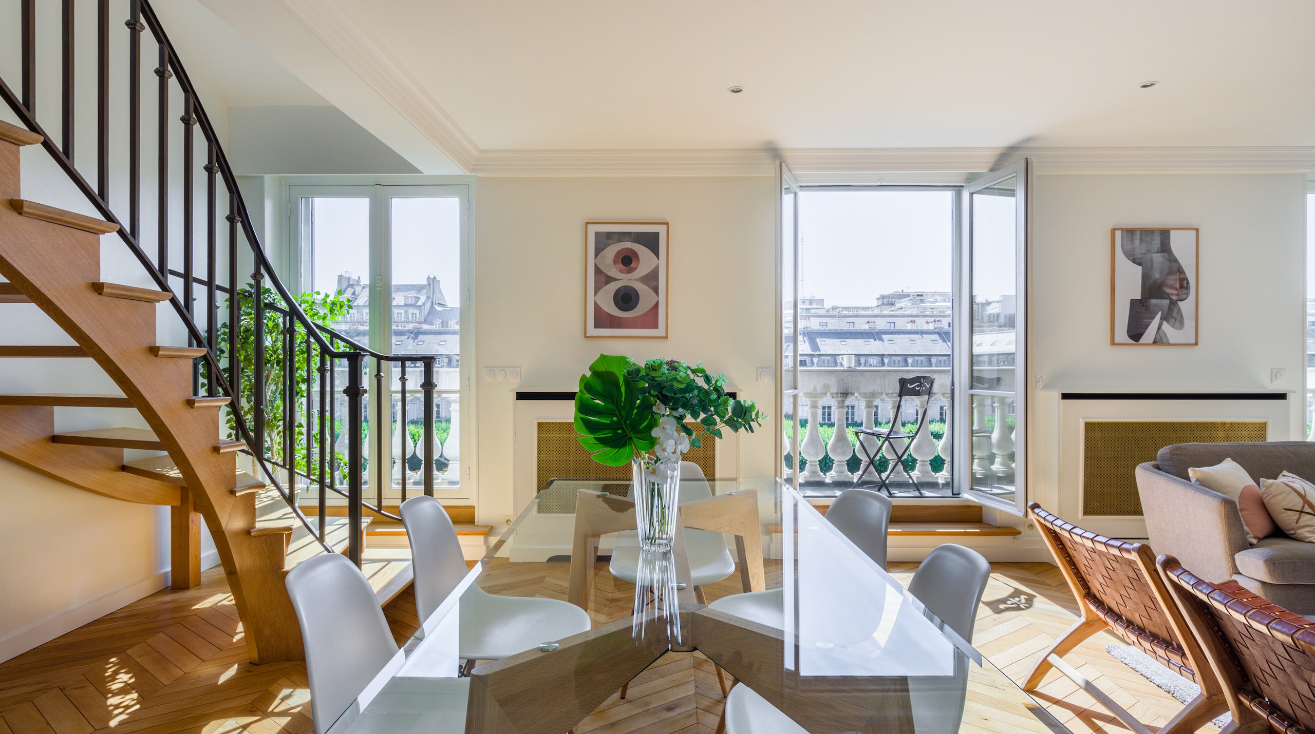 Dining room flanked by salon and staircase and overlooking the Jardin du Palais Royal in Paris