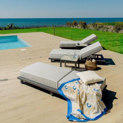 Catch a few rays on the sun loungers before taking a dip in the pool to cool off