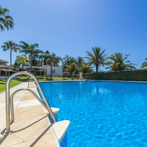 Cool off in the communal swimming pool after a game of tennis