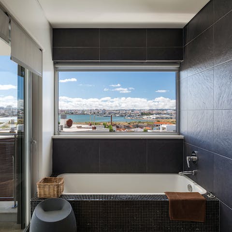 Have a soak in the bath while you gaze out at the view