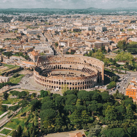 Visit the famous Colosseum, a thirteen-minute walk away