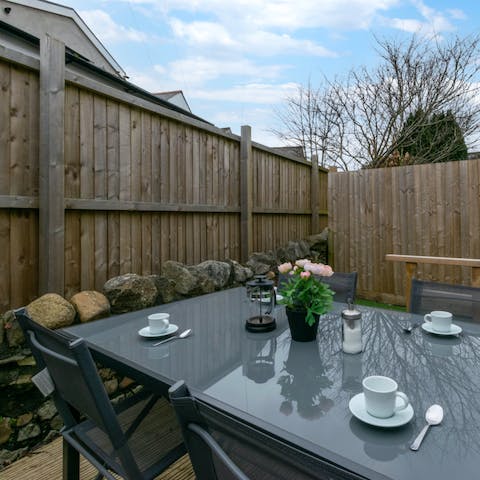 Forget that you're staying in the city and dine alfresco in your private garden