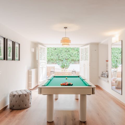 Get competitive with a round of billiards in the games room