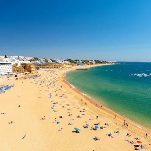 Pack up the family for a beach day at Praia de Vilamoura, 12km away