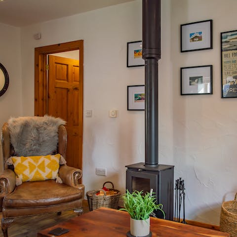 Snuggle up in the cosy living room in front of the log burner