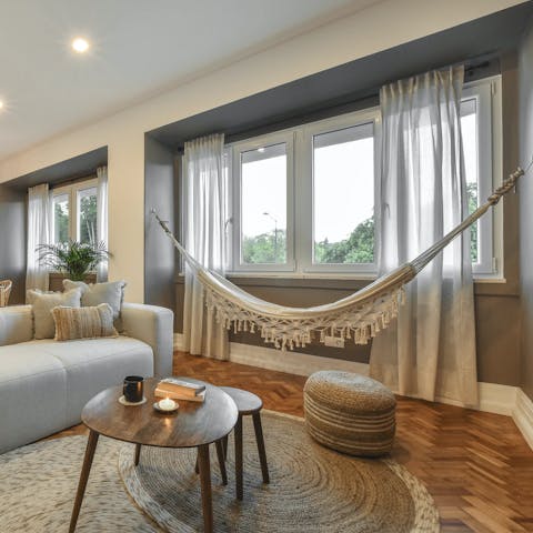 Spend a relaxing morning hanging out in the living room's hammock