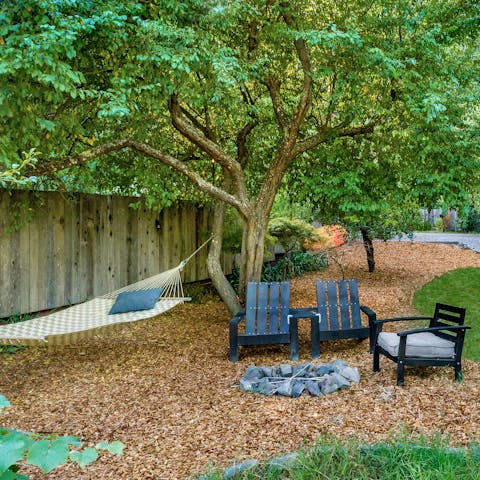 Sit around the fire pit or relax with a book in the hammock