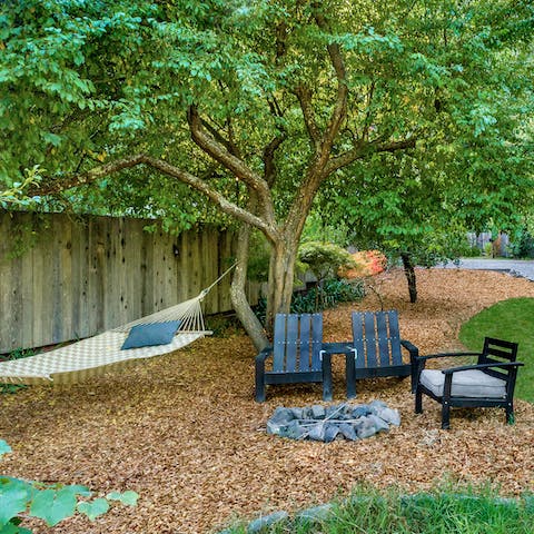 Sit around the fire pit or relax with a book in the hammock
